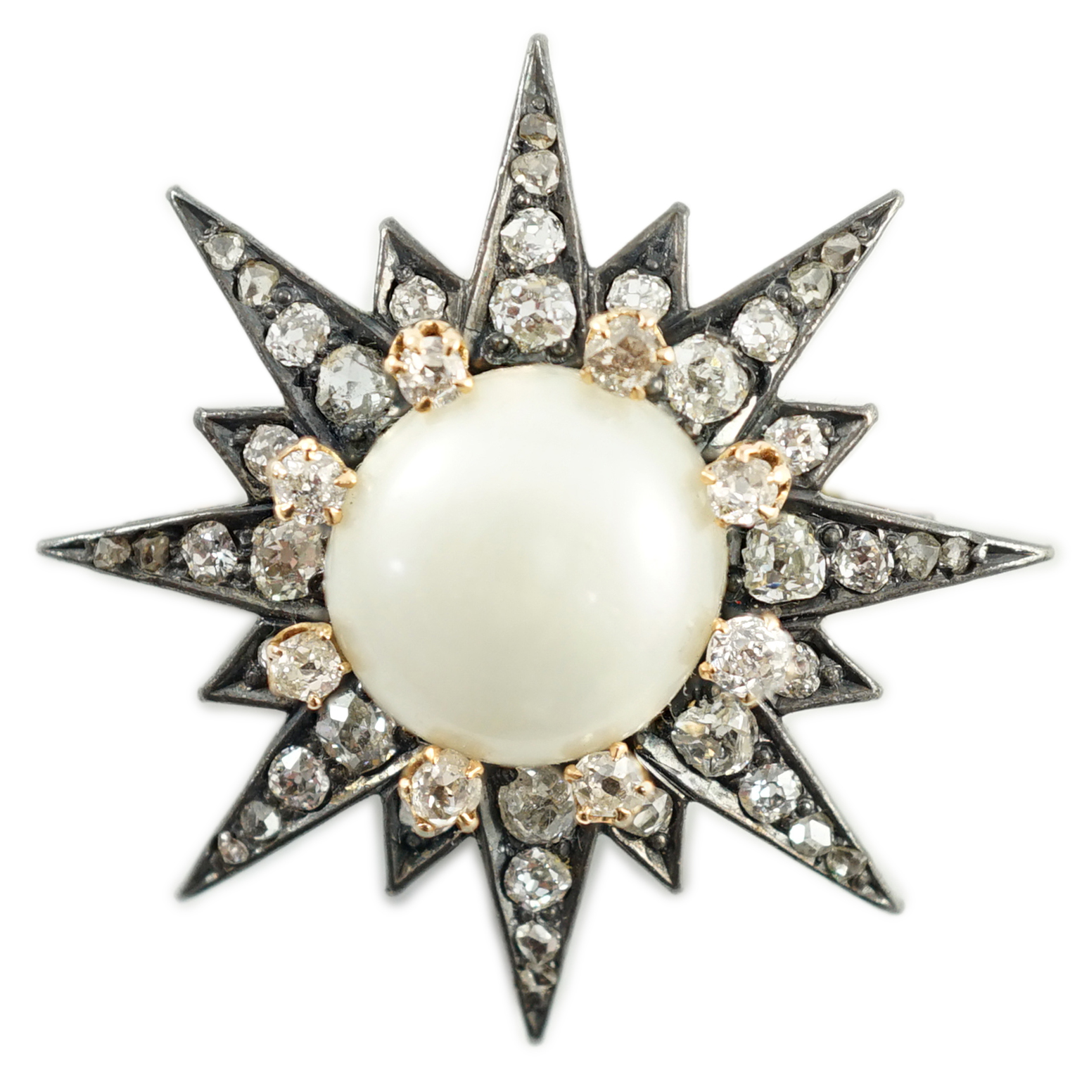 A Victorian gold and silver, button pearl and graduated round and rose cut diamond set cluster starburst brooch